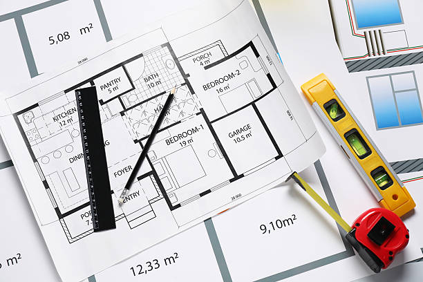 different tools on architectural drawings, flat lay